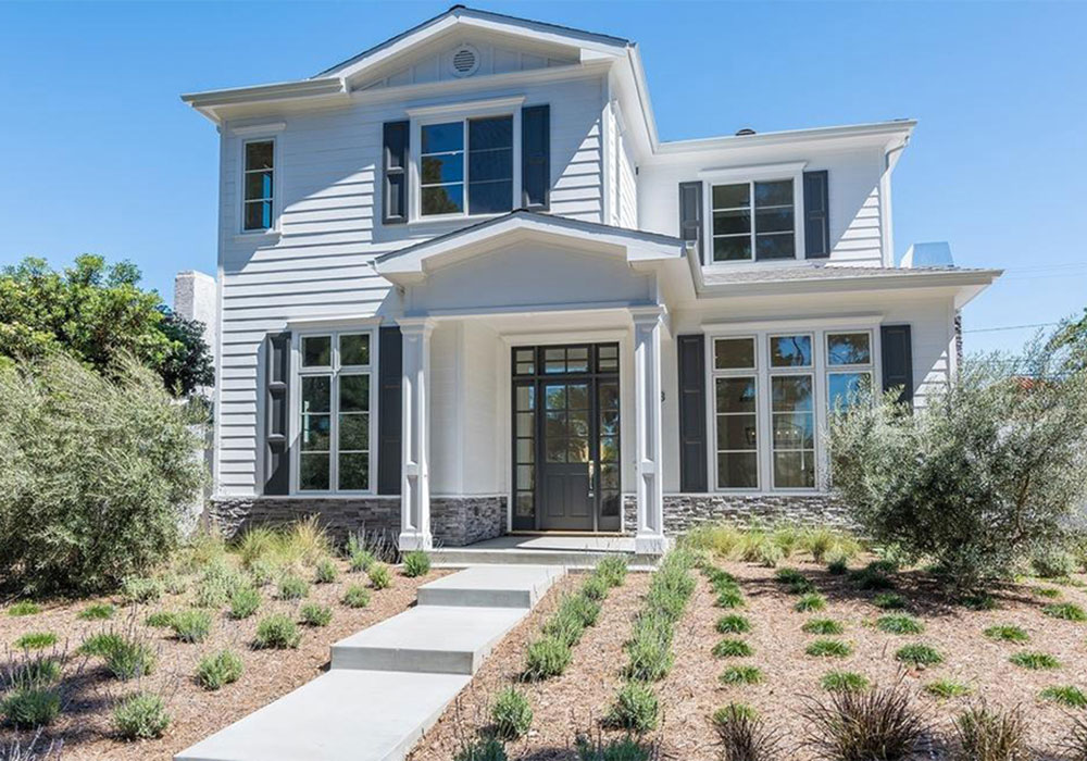 Exterior view of Gary Barlow’s beachfront Santa Monica home with pool and ocean views