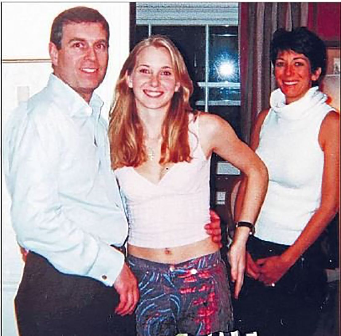 Prince Andrew with Virginia Giuffre in a 2001 photo, which became central to public speculation about his ties to Jeffrey Epstein.
