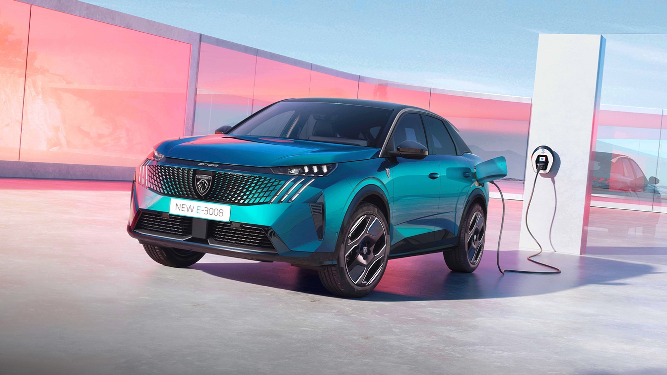 Peugeot E-3008 electric SUV charging at a public EV station, illustrating Stellantis’ electric vehicle lineup.
