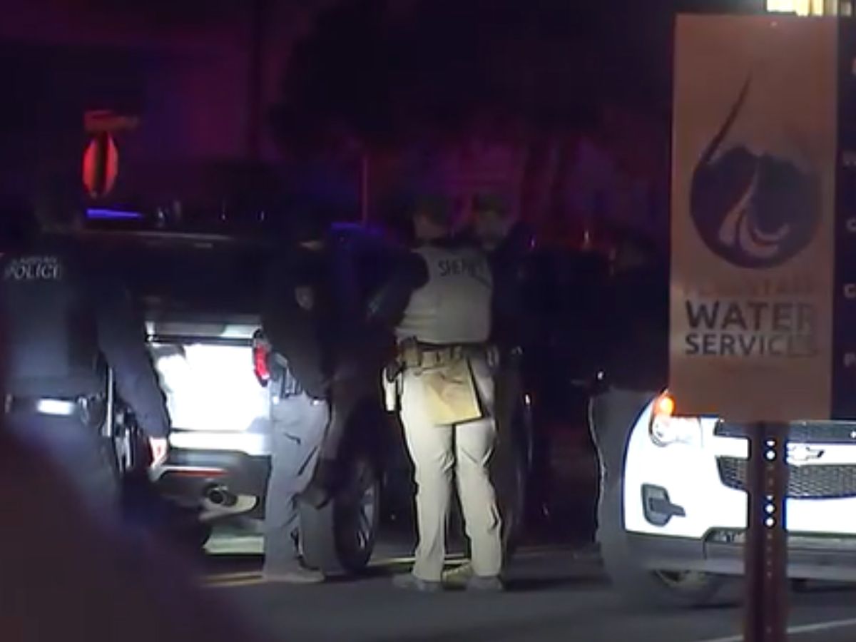 : Arizona law enforcement officers at an active scene following a DPS helicopter crash in Flagstaff