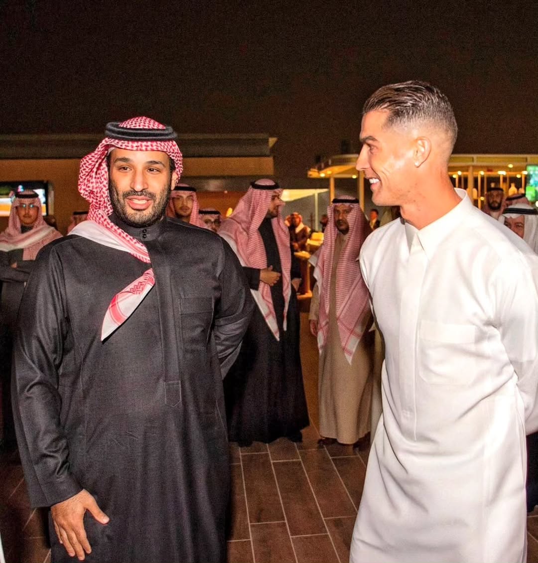 Mohammed bin Salman standing alongside Cristiano Ronaldo, highlighting the Saudi investment fund’s backing of the football superstar.
