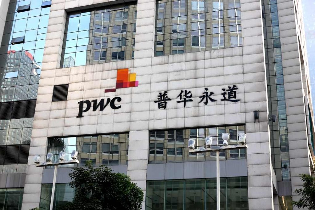 PwC office building with logo after Evergrande audit scandal and $166 million fine