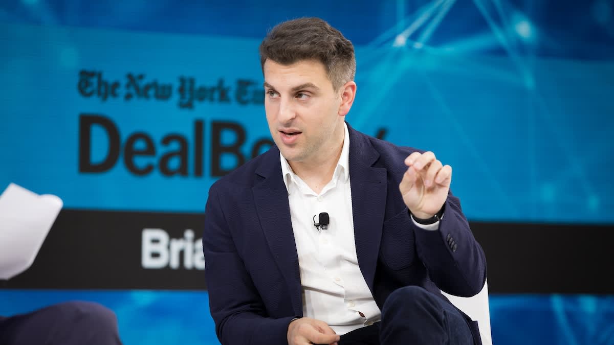 Airbnb CEO Brian Chesky discussing AI and the future of management jobs