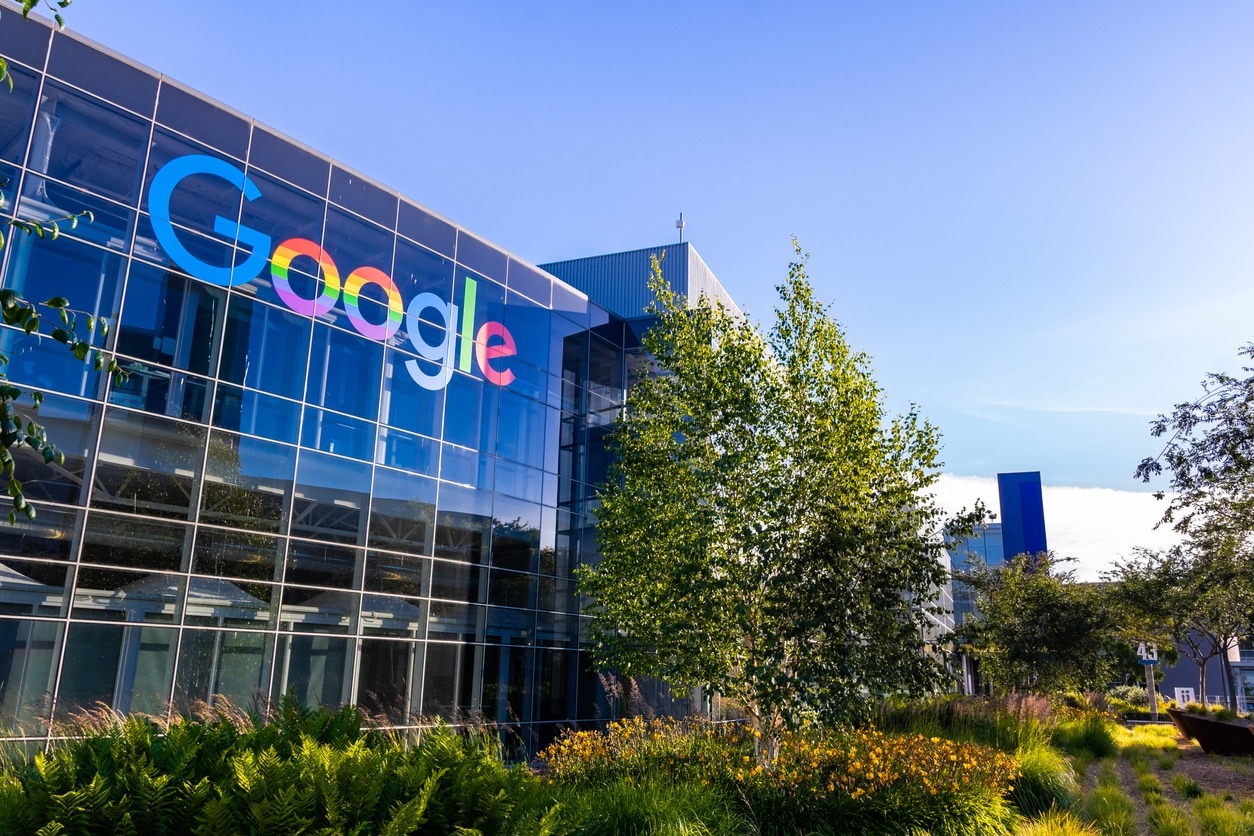 Google logo displayed outside company offices amid insider trading allegations.
