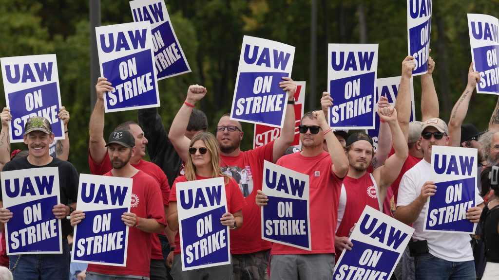 UAW workers on strike outside a Michigan supplier plant that produces axle components for General Motors pickup trucks.