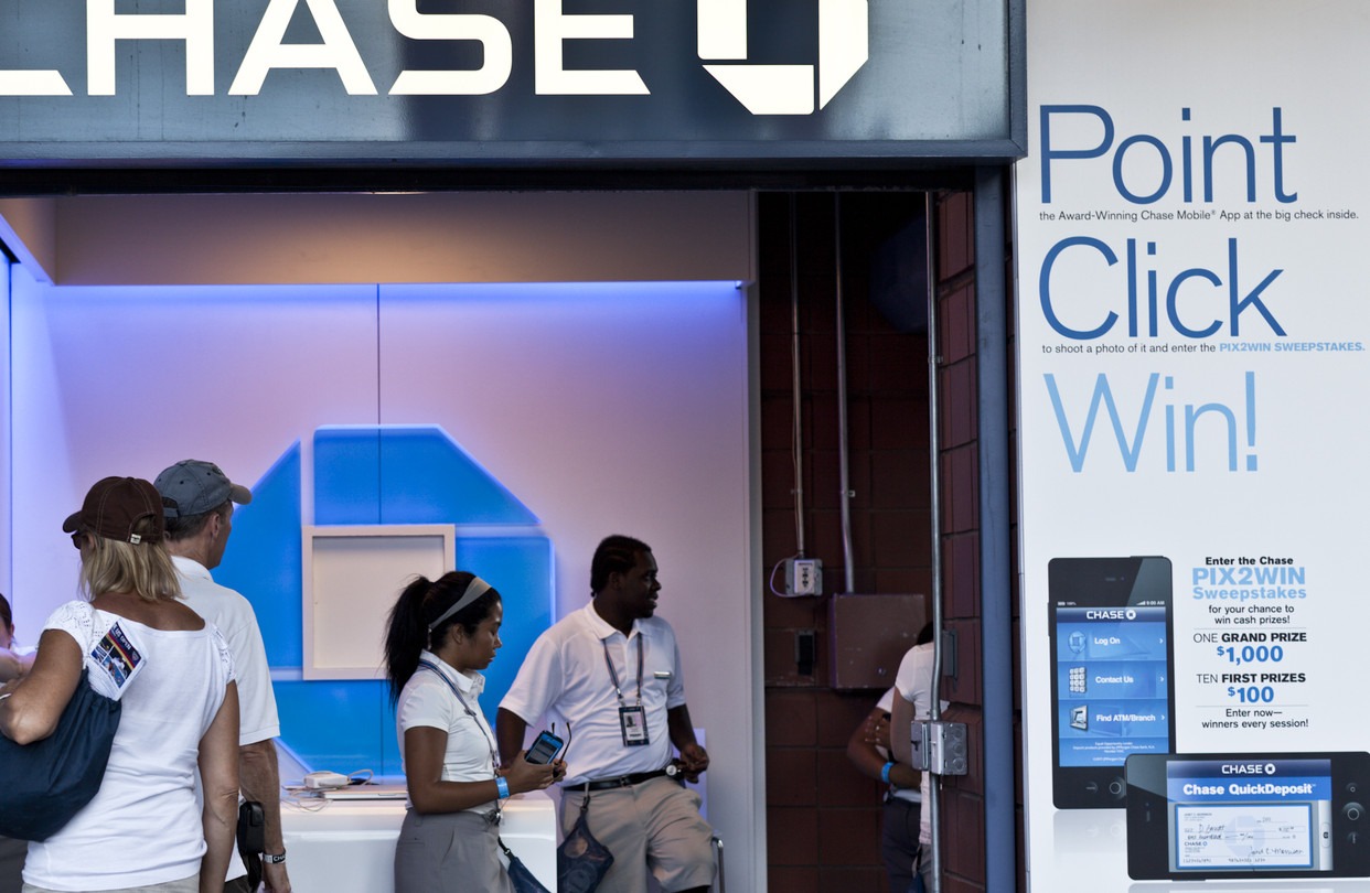 Customers enter a U.S. bank as regulators increase oversight of financial activity